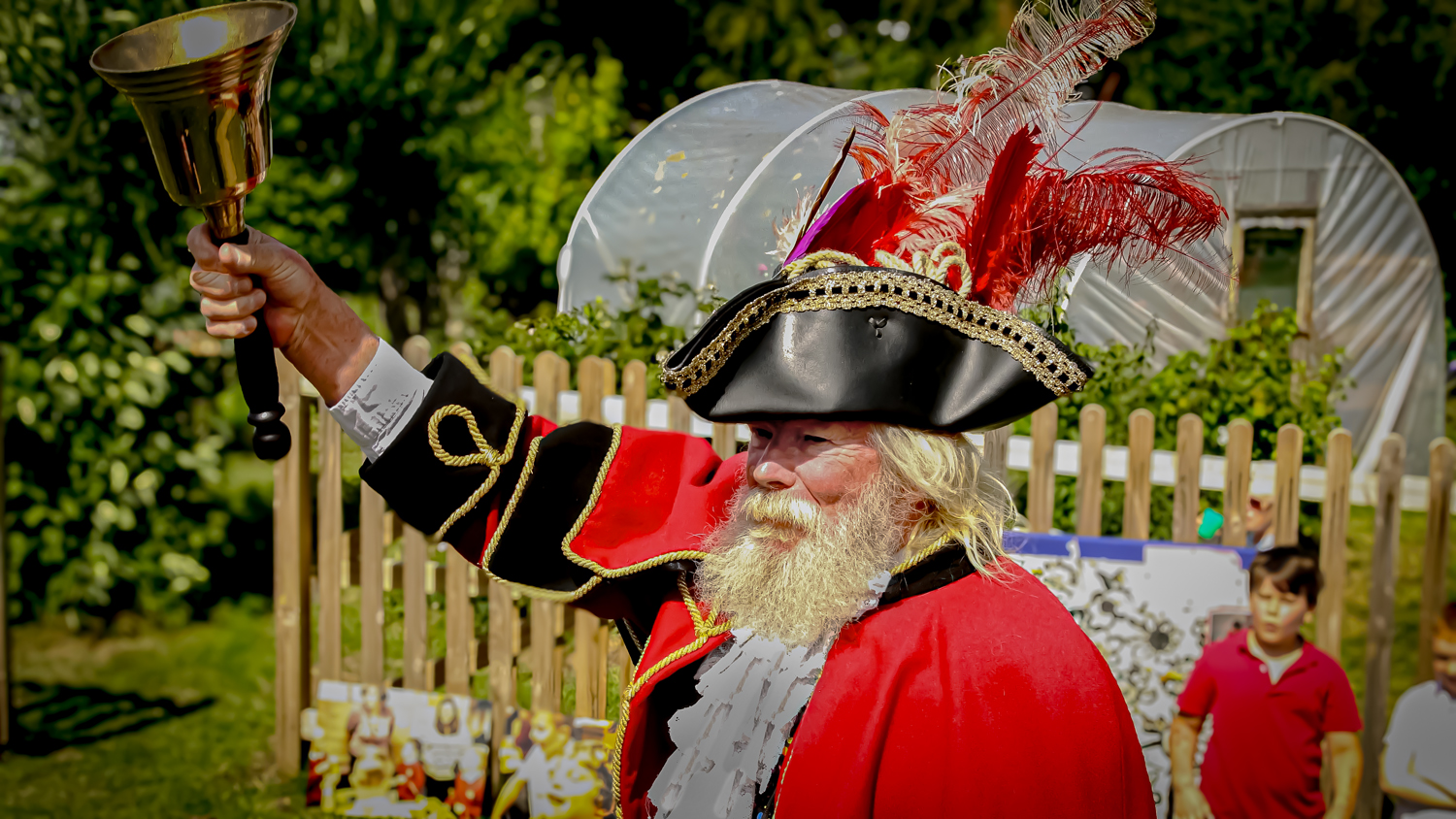 town crier rings bell